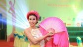Cựu chủ công Lê Hương Giang giờ đây dịu dàng trong các cuộc thi sắc đẹp. Ảnh: NVCC