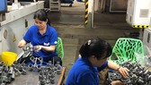 Công nhân làm việc tại Công ty cổ phần Nhựa Bình Minh, quận 6, TPHCM