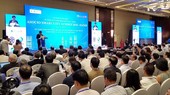 The Chairman of the Hanoi People’s Committee Nguyen Duc Chung delivered his opening speech at the ASOCIO Summit. Photo by Tran Binh