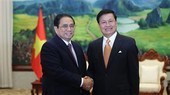 PM Pham Minh Chinh meets with Party General Secretary, President of Laos