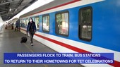 Passengers flock to train, bus stations to return to hometowns for Tet