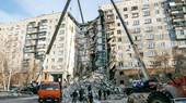 The rubble of the partially collapsed apartment building