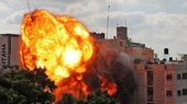 Một quả rocket do lực lượng Israel bắn nhấn chìm tòa nhà Al-Walid ở thành phố Gaza hôm 13/5. Trong bối cảnh xung đột Israel-Palestine bước sang tuần thứ 2, ĐHĐ LHQ sẽ họp công khai vào ngày 20/5, thỏa luận về tình hình tại đây. (Nguồn: Reuters)