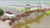 Công trình cầu kiều với chất liệu chủ yếu là gỗ bắc qua kênh tại cổng vào chính của khuôn viên tràm.