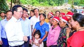 President visits families affected by flash flood in Lao Cai Province