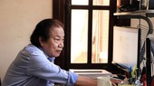 Prof. Dr. Tran Doan Son is working on his computer for meaningful research