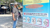 The panel to instruction citizens in Nhon Duc Commune (Nha Be District) to carry out public services online. (Photo: SGGP)
