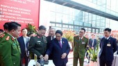 Prime Minister Pham Minh Chinh and conference participants are learning about utility applications for Project 06.