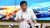 Minister of Planning and Investment Nguyen Chi Dung speaks at the conference.
