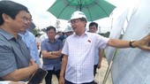 Deputy Chairman of the National Assembly's Economic Committee, Nguyen Minh Son (R) leads an inspection delegation to inspect the ground leveling area and Loc An-Binh Son resettlement area at Long Thanh International Airport.