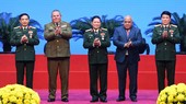 Divisional General Víctor Rojo Ramos, head of the Political Directorate of the Cuban Revolutionary Armed Forces (FAR) (2nd, L), and Cuban Ambassador to Vietnam Orlando Nicolas Hernandez Guillen (2nd, R) present Orders of Playa Girón to General Phan Van Gi