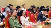 Politburo member and Permanent member of Party Central Committee's Secretariat Truong Thi Mai (2nd, R) and Minister of Public Security, General To Lam (L) attend the conference. (Photo: SGGP)
