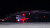 The flight is welcomed with a water cannon salute at Phu Bai International Airport in Thua Thien - Hue on July 2. (Photo: SGGP)