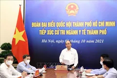 Chủ tịch nước Nguyễn Xuân Phúc tiếp xúc cử tri ngành y tế TPHCM theo hình thức trực tuyến. Ảnh: TTXVN