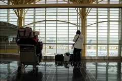 Hành khách tại sân bay quốc gia Ronald Reagan Washington ở Arlington, Virginia, Mỹ. Ảnh minh họa: THX/TTXVN