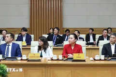 Đại diện lãnh đạo doanh nghiệp bán dẫn quốc tế tham dự buổi tiếp. (Ảnh: Dương Giang/TTXVN)