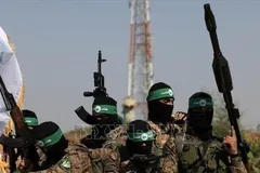 Các tay súng Lữ đoàn Al-Qassam, một cánh quân của Phong trào Hồi giáo Hamas. Ảnh: IRNA/TTXVN