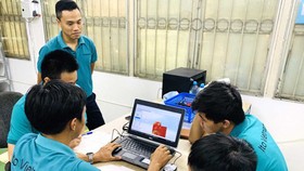 Engineers of ITO Vietnam Co. Ltd., an enterprise that has just received its STE certificate. (Photo: SGGP)
