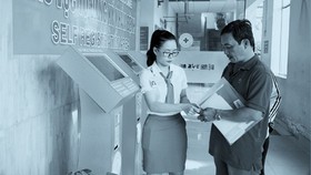 Patients are checking in a hospital using the kiosk system