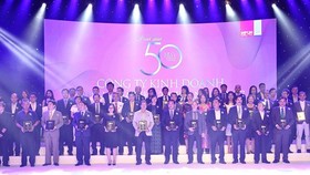 Mr. Nguyen Quoc Khanh, Managing Director of Vinamilk and other company staff on the event scene.