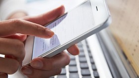 Bank customers have been warned of a new type of scam involving official-looking messages (Source: VNA)