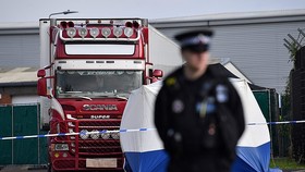 A police officer at the scene where the lorry was discovered in Grays, Essex, on October 23