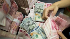 Tewoo Group Corp is owned by the Tianjin government and operates in a number of industries including infrastructure, logistics, mining, autos and ports, according to its website.PHOTO: AFP