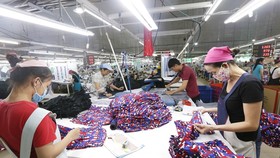 Các dây chuyền dệt may của công ty Cổ phần dệt may Phú Hòa An tại KCN Phú Bài, tỉnh Thừa Thiên Huế. (Ảnh: Anh Tuấn/TTXVN)