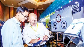 Introducing a piece of security software at a national conference on cyber safety. (Photo: VNA)