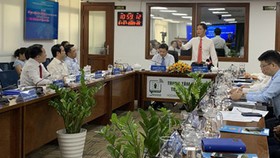 Minister of Industry and Trade Tran Tuan Anh shared solutions to form connections between his ministry and media units. (Photo: SGGP)