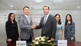 Representatives of IFC and OCB at the signing of the loan agreement (Photo: VNA)