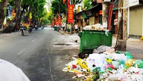 Tons of trash build up across downtown Hanoi