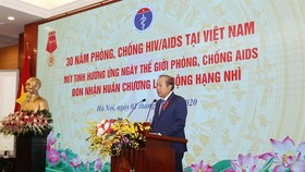 Permanent Deputy Prime Minister Truong Hoa Binhspeaks at a meeting to mark the World AIDS Day 2020 (December 1) and review 30 years of HIV/AIDS prevention and control in Vietnam on Tuesday. —Photo Ministry of Health