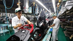 The national programme is considered a new push to support enterprises in the context of the Fourth Industrial Revolution (Photo: vietq.vn)
