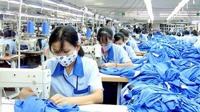 Dịch Covid-19 làm ảnh hưởng đến người lao động. Ảnh minh họa: MỸ HẠNH