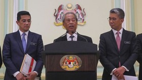 In a photo taken on March 16, 2020, Prime Minister Muhyiddin Yassin (centre) speaks during a press conference at the Prime Minister Office in Putrajaya, Malaysia. (Photo: straitstimes.com)