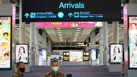 Immigration officers stand in front of an arrivals hall at Suvarnabhumi airport (Source: Reuters)