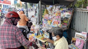 An old news-stand on the side of the road