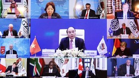 Prime Minister Nguyen Xuan Phuc (centre) speaks at the second online discussion within the framework of the G20 Summit on November 22 (Photo: VNA)