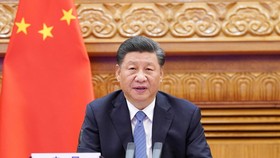 Chủ tịch Trung Quốc Tập Cận Bình tham dự hội nghị thượng đỉnh G20 qua liên kết video ở Bắc Kinh hôm 21-11. Ảnh: Xinhua