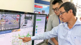 Doanh nghiệp giới thiệu bản đồ số giao thông. Ảnh: TẤN BA