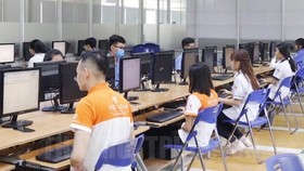 Thí sinh thể hiện phần thi lý thuyết tại Trường Cao đẳng Công nghệ Thủ Đức. Ảnh: hcmcpv