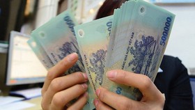 Tiền lương năm 2021 có giảm theo mức thắt chặt ngân sách?