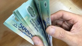 Chưa điều chỉnh tiền lương cơ sở và chuẩn nghèo trong năm 2021