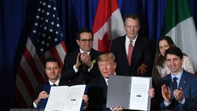 Lễ ký kết USMCA hồi năm 2018. (Ảnh: AFP/TTXVN)