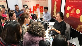 Tỷ giá trung tâm tăng mạnh, giá vàng chững lại trước ngày Thần Tài