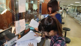 Nhiều điều kiện kinh doanh thực hiện cắt bỏ song thực sự không tạo thuận lợi rõ ràng cho doanh nghiệp. (Ảnh: PV/Vietnam+)