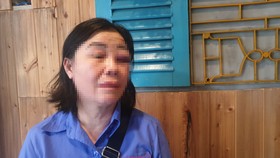 Bà Oanh với vết thương trên mắt