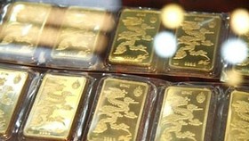 Gold escalates to above VND62 million per tael