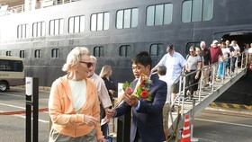 At welcoming ceremony greeting first international cruise visitors on the lunar New Year